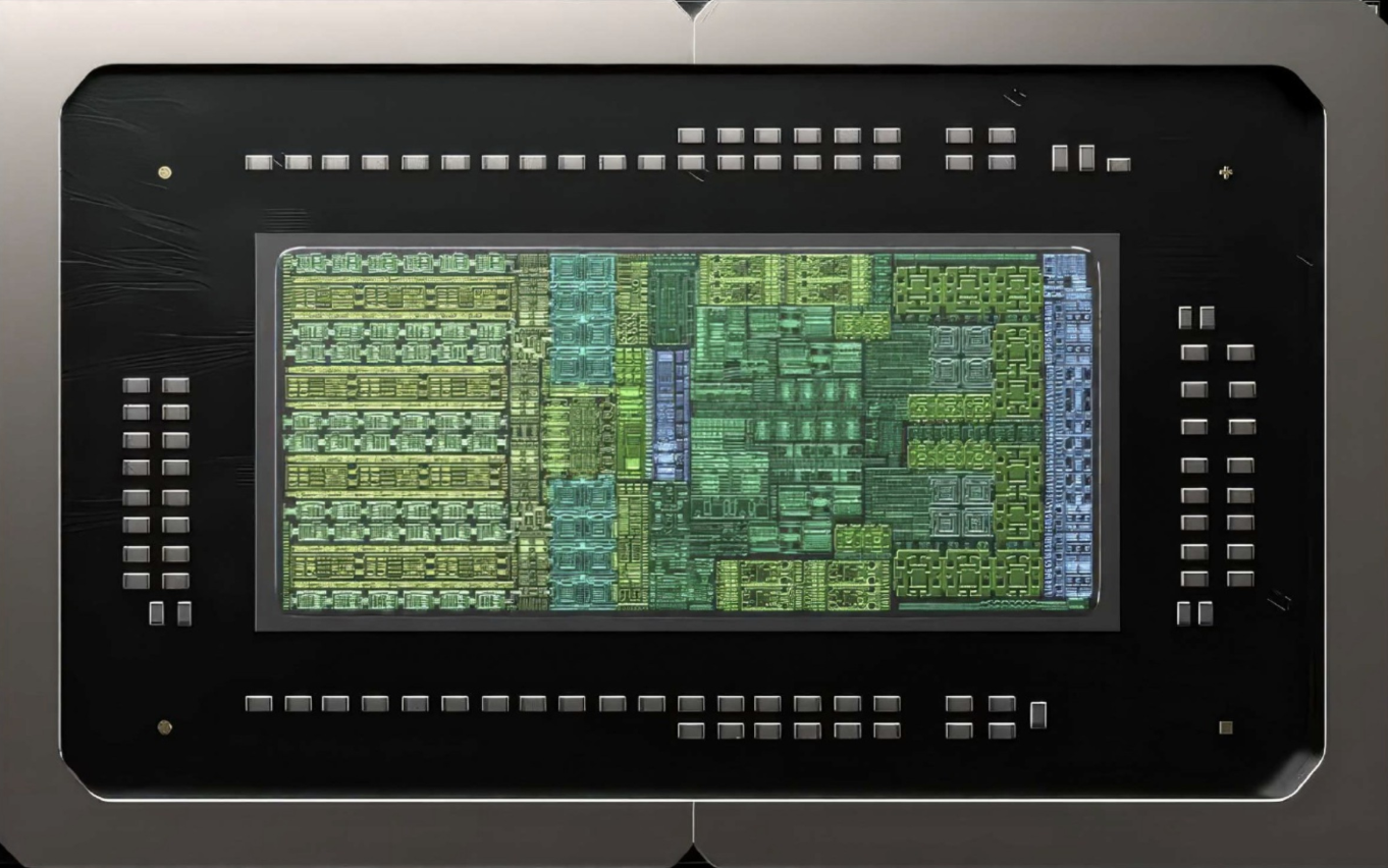 Macro photograph of a modern high-density compute die package mounted on an organic substrate with perimeter decoupling capacitors and advanced interposer routing